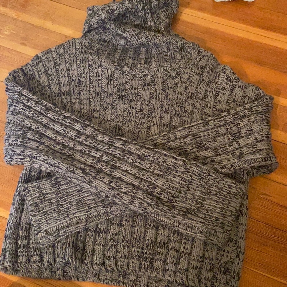 Black and grey knitted turtleneck sweater